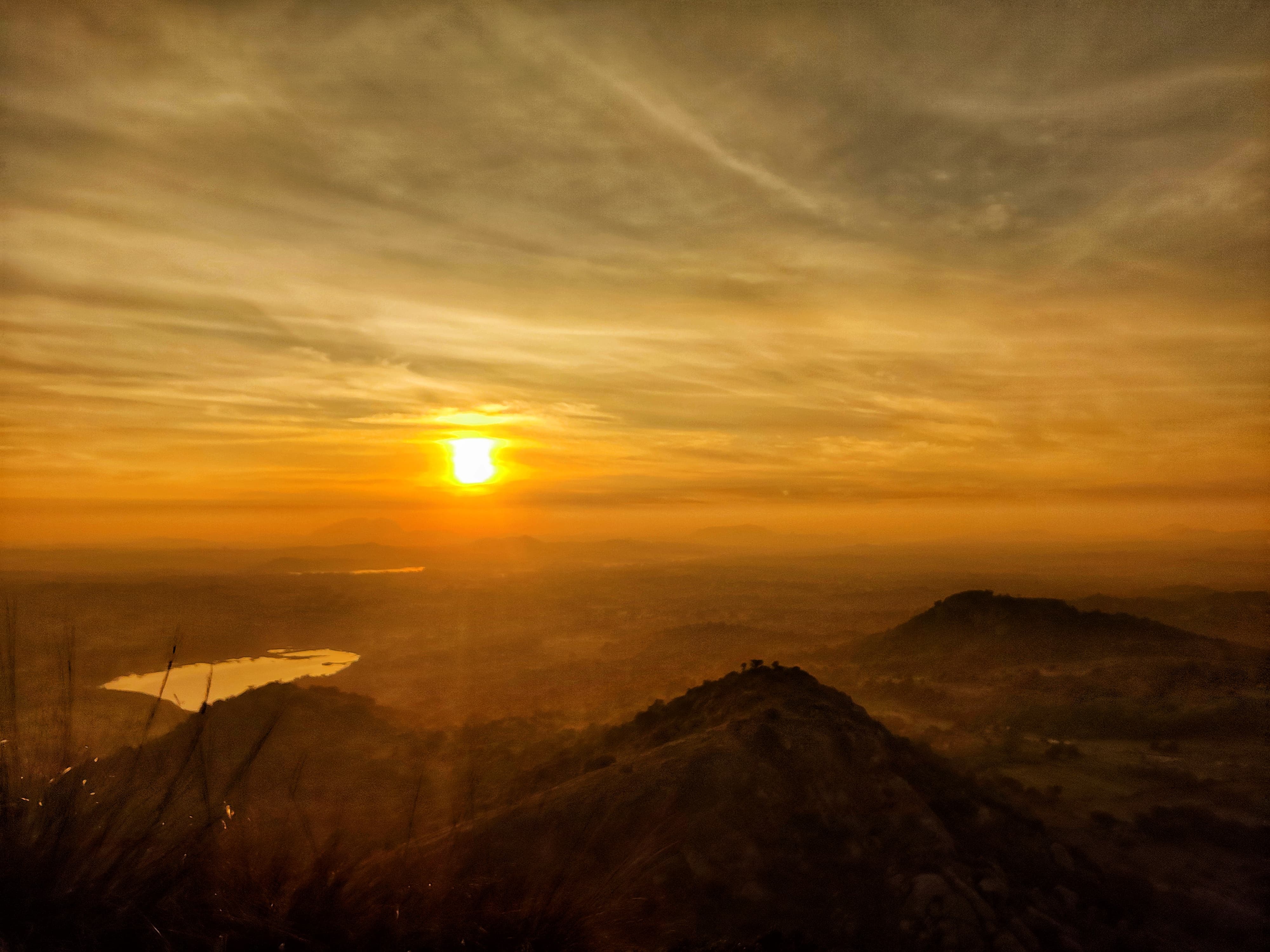 Morning mist and golden sunrise from Uttaribetta peak